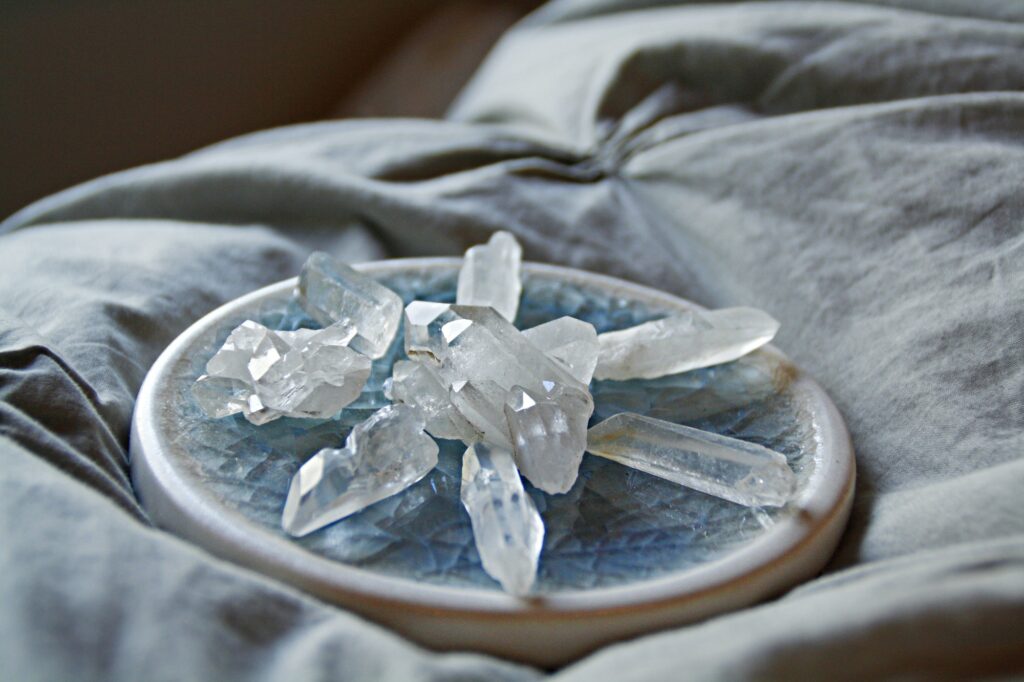 Collection of healing crystals on a gray cushion